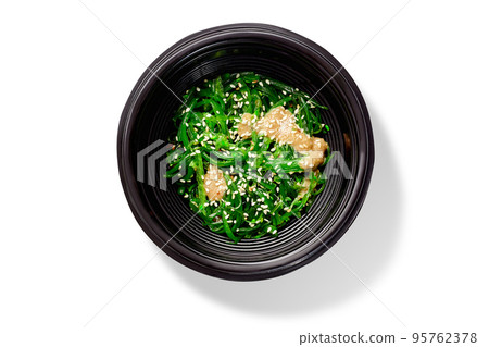Japanese dish of spicy pickled hiyashi seaweeds with peanut sauce and sesame Japanese dish of spicy pickled hiyashi seaweeds with peanut sauce and sesame 95762378