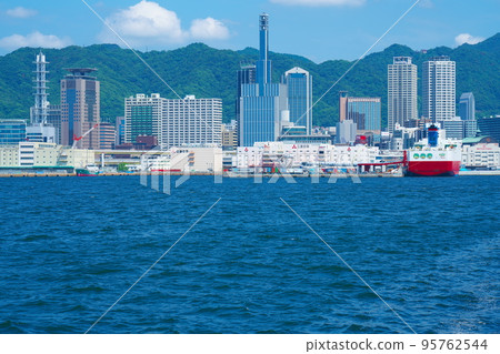 Buildings in Sannomiya and Miyazaki Car Ferry Kobe Express anchored at Kobe Port Chuo Ward, Kobe City, Hyogo Prefecture 95762544