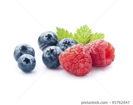 Sweet raspberry and blueberry with leaves on white backgrounds. Sweet raspberry and blueberry with leaves on white backgrounds. 95762847
