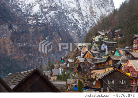 Hallstatt, a charming village on the Hallstattersee lake and a famous tourist attraction, with beautiful mountains surrounding it, in Salzkammergut region, Austria, in winter sunny day. Hallstatt, a charming village on the Hallstattersee lake and a famous tourist attraction, with beautiful mountains surrounding it, in Salzkammergut region, Austria, in winter sunny day. 95763878