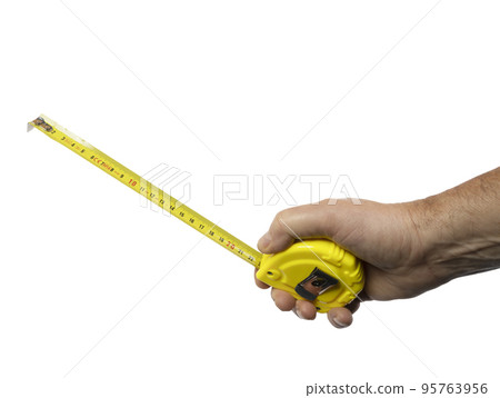a male hand with a rollable tape measure 95763956