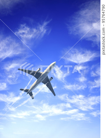 Vertical nature background with aircraft and Jet trailing smoke in the sky. Airplane and condensation trail 95764790