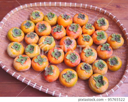 Freshly harvested persimmon Freshly harvested persimmon 95765522