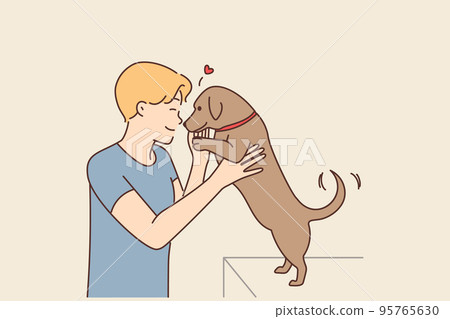 Happy man playing with dog Happy man playing with dog 95765630