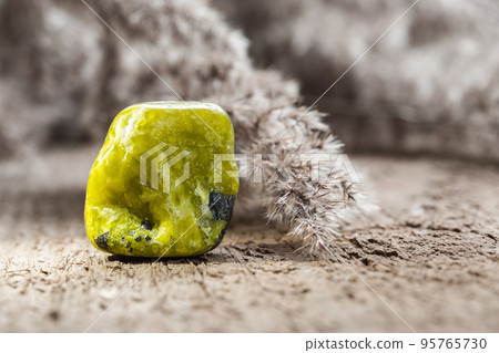 Yellow Lizardite Mineral Rock Specimen on Wood Yellow Lizardite Mineral Rock Specimen on Wood 95765730