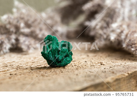 Raw Uncut Malachite Mineral Gem Stone on Wood 95765731