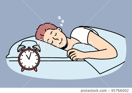 Happy man lying in bed sleeping  95766002