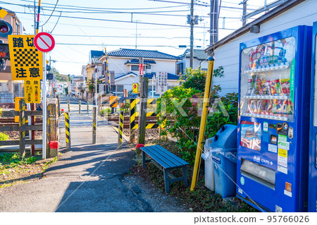 Bench and vending machine at the railroad crossing for the elderly 95766026