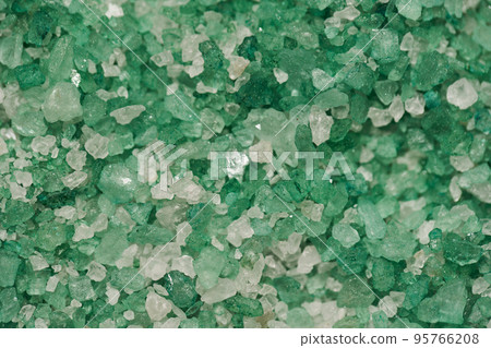 Texture of sea salt white and green color in close-up. Body treatment, skin care concept. Texture of sea salt white and green color in close-up. Body treatment, skin care concept. 95766208
