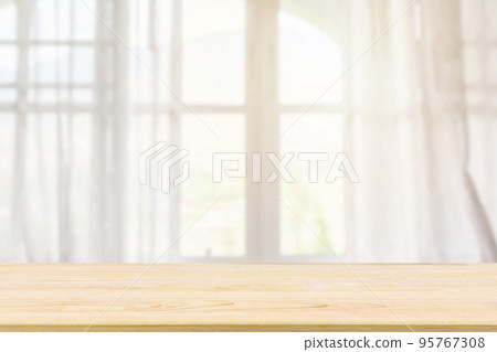 Empty wood table top with window curtain abstract blur background for product display 95767308