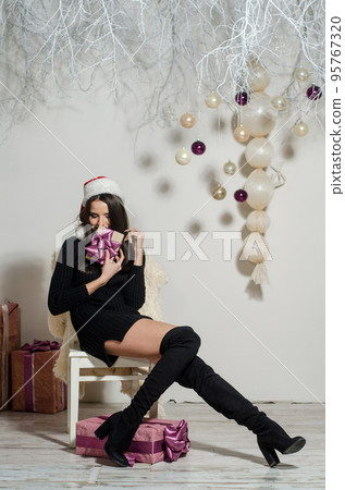 sexy surprised woman wearing santa claus clothes. sexy surprised woman wearing santa claus clothes. 95767320