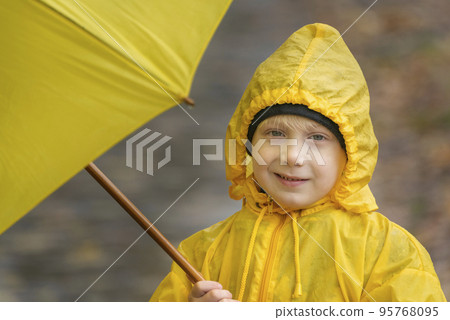 Portrait of smiling child in yellow raincoat. Stock Photo 95768095 PIXTA