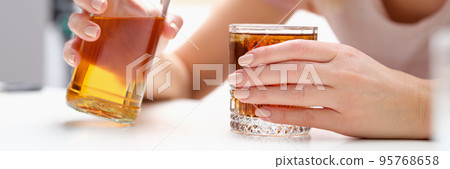 Woman with bottle of alcohol and glass alone Woman with bottle of alcohol and glass alone 95768658