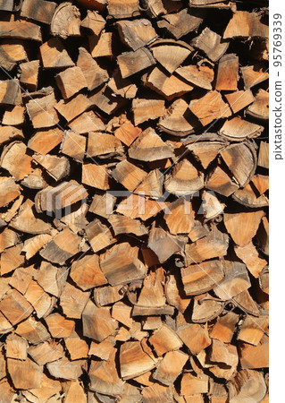 Firewood dried and stored in the firewood shelf 95769339