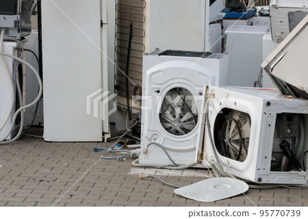 A close-up of old, used household appliances. Electoronics landfill. A close-up of old, used household appliances. Electoronics landfill. 95770739