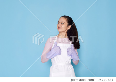 woman in gloves and cleaner apron showing ok sign woman in gloves and cleaner apron showing ok sign 95770785