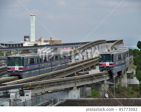 Passing between monorails Osaka monorail 1000 series vehicle Passing between monorails Osaka monorail 1000 series vehicle 95773082