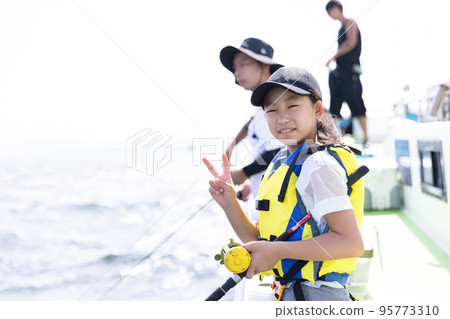 Parents enjoying fishing 95773310