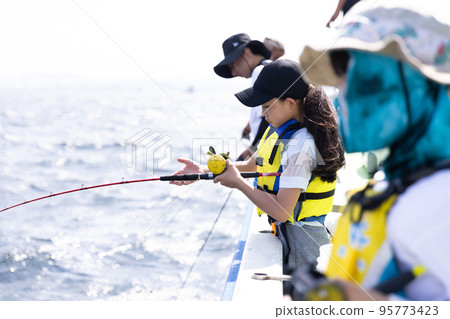 Girl enjoying fishing Girl enjoying fishing 95773423