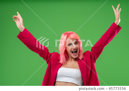 Excited extravagant girl posing for the camera in a studio 95773556