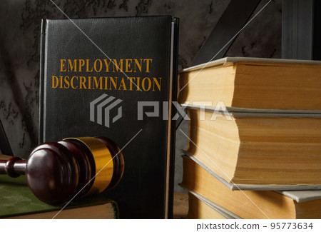 Book with law about Employment discrimination and gavel. 95773634
