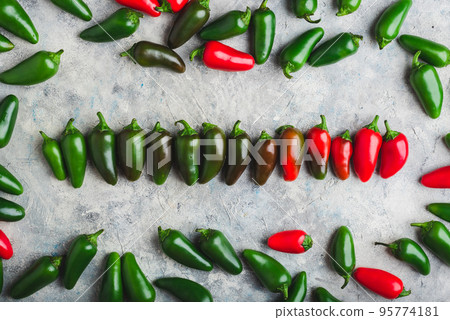 Row of Jalapeno Peppers on Concrete Background Row of Jalapeno Peppers on Concrete Background 95774181