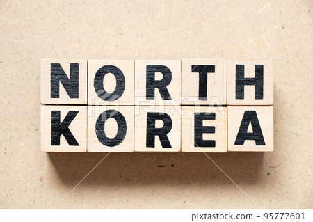 Alphabet letter block in word north korea on wood background 95777601