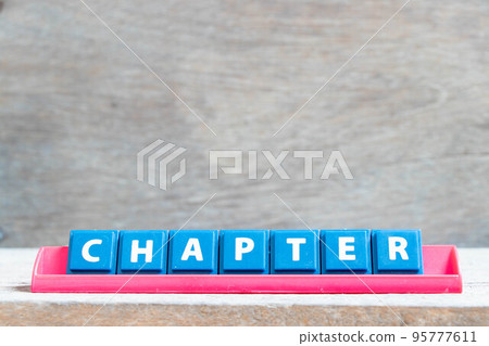Tile alphabet letter with word chapter in red color rack on wood background 95777611