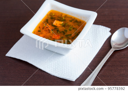 Chicken soup in the white ceramic bowl 95778392