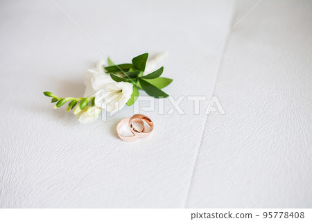 rings and flowers. Groom's boutonniere. Wedding boutonniere of roses. 95778408