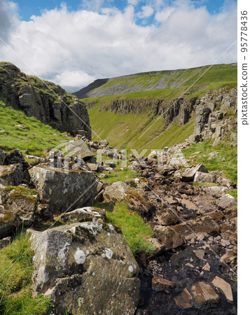 Stream runs over High Cup Nick, Eden Valley, North Pennines, Cumbria 95778436