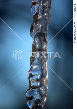 transparent icicle close up against the sky transparent icicle close up against the sky 95778641