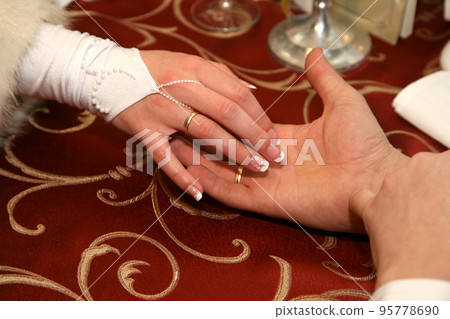 hands of the bride and groom together hands of the bride and groom together 95778690