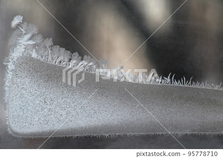 unusual frost on a winter window 95778710