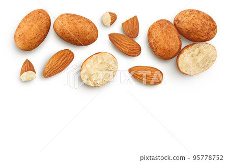 Marzipan balls or potatoes with almond isolated on white background full depth of field. Top view with copy space for your text. Flat lay 95778752