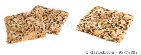 crispy cookie with seeds of sunflower, flax and sesame seeds Isolated on white background 95778892