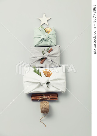 reusable sustainable gift wrapping in linen fabric. Furoshiki gifts. zero waste concept flat lay reusable sustainable gift wrapping in linen fabric. Furoshiki gifts. zero waste concept flat lay 95778963