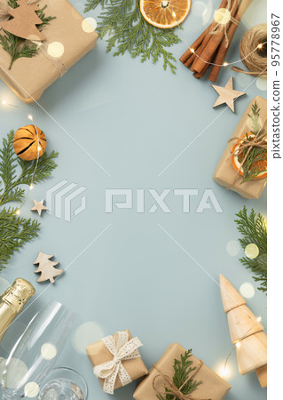Natural color Christmas gift boxes on blue background, eco friendly trendy zero waste packaging flat lay top view, Christmas frame 95778967