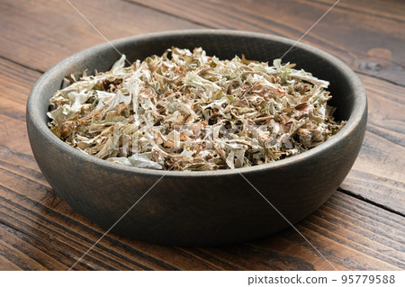 Bowl of dried Iceland moss for making healthy herbal cough tea.  Icelandic moss, natural cough medicine. Alternative herbal medicine. 95779588