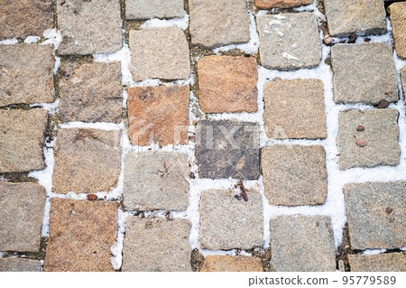 Road paving slabs pattern. Way paved with stones. 95779589