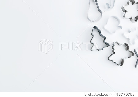 Silver molds for homemade Christmas cookies isolated on white. Christmas cakes. Copy space 95779793