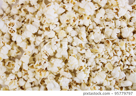 Fresh popcorn background. Popcorn texture. Corn snacks close up. 95779797