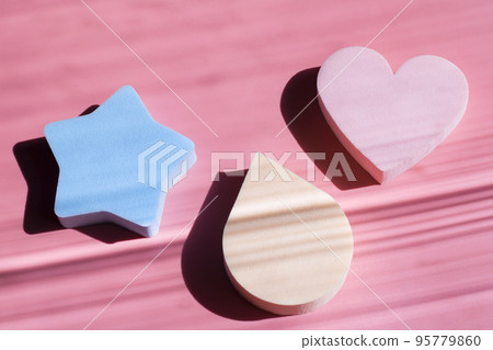 Cosmetic sponges in pastel colors on a pink background with deep shadows. Beauty concept. Copy space Cosmetic sponges in pastel colors on a pink background with deep shadows. Beauty concept. Copy space 95779860