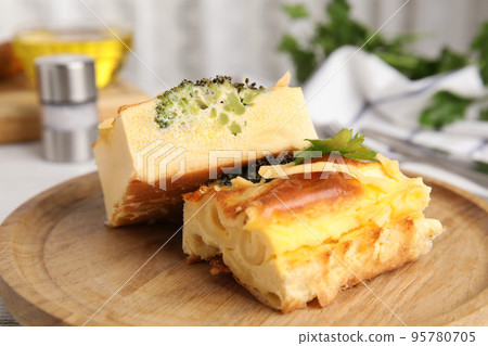 Tasty broccoli casserole on wooden board, closeup Tasty broccoli casserole on wooden board, closeup 95780705