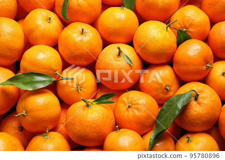 Delicious fresh ripe juicy tangerines as background Delicious fresh ripe juicy tangerines as background 95780896