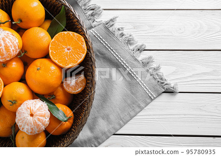 Fresh ripe tangerines on white wooden table, top view Fresh ripe tangerines on white wooden table, top view 95780935
