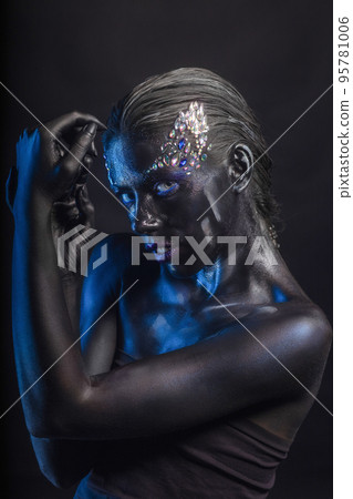 Sexy brunette with makeup on her face 95781006