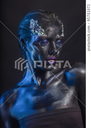 Sexy young woman with creative makeup on her face 95781071