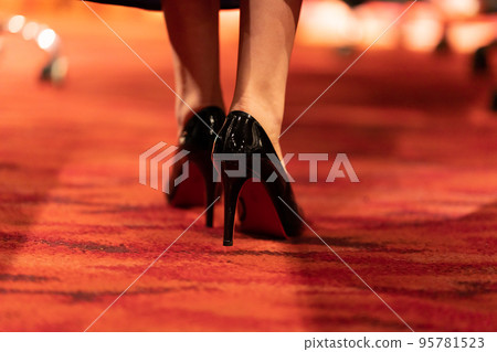 Women's feet wearing stiletto heels Women's feet wearing stiletto heels 95781523