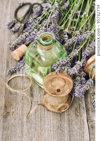 Lavender flowers herbal oil bottle rustic vintage wooden background Lavender flowers herbal oil bottle rustic vintage wooden background 95782734
